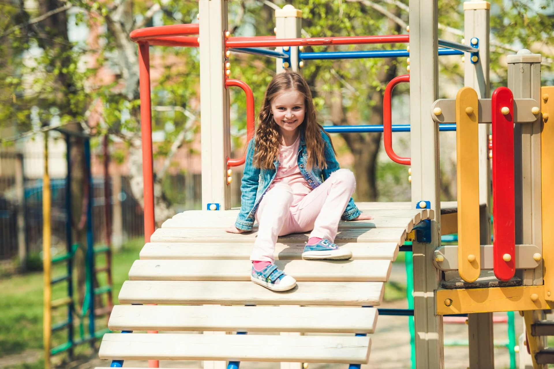 little-girl-playing-on-a-playground-ladder